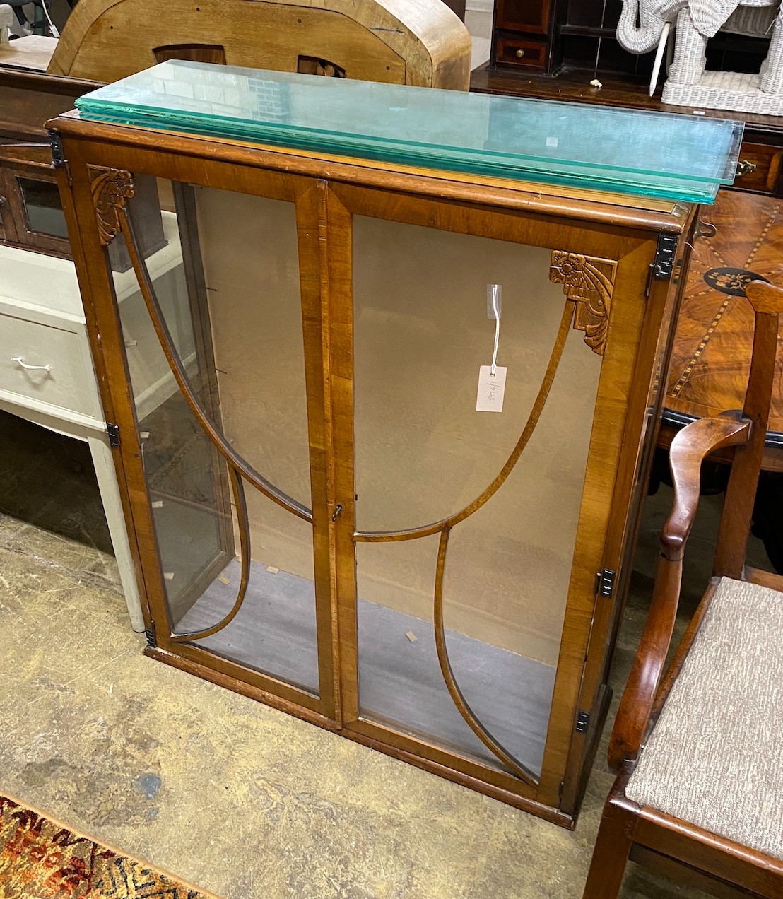 An Art Deco walnut display cabinet, feet detached, width 90cm, depth 31cm, height 113cm